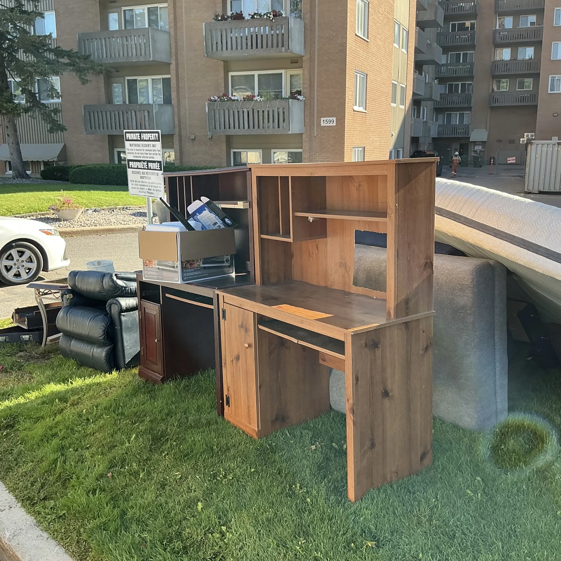 Furniture and bulky items set out at an Ottawa apartment property — Cornerstone Waste Solutions job site